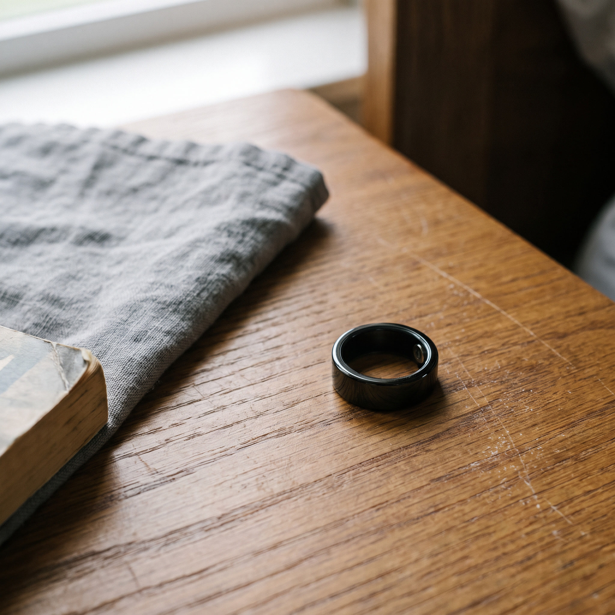 CIRCA smart ring on a walnut nightstand